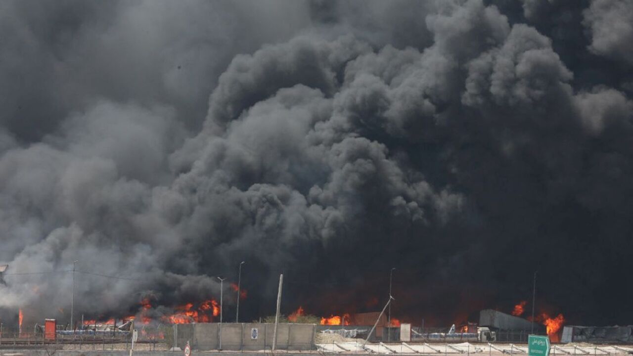 Thick black smoke still billows two days after a deadly blast at Iran's Shahid Rajaee Port, in a photo provided by the Iranian Red Crescent Thick black smoke still billows two days after a deadly blast at Iran's Shahid Rajaee Port, in a photo provided by the Iranian Red Crescent