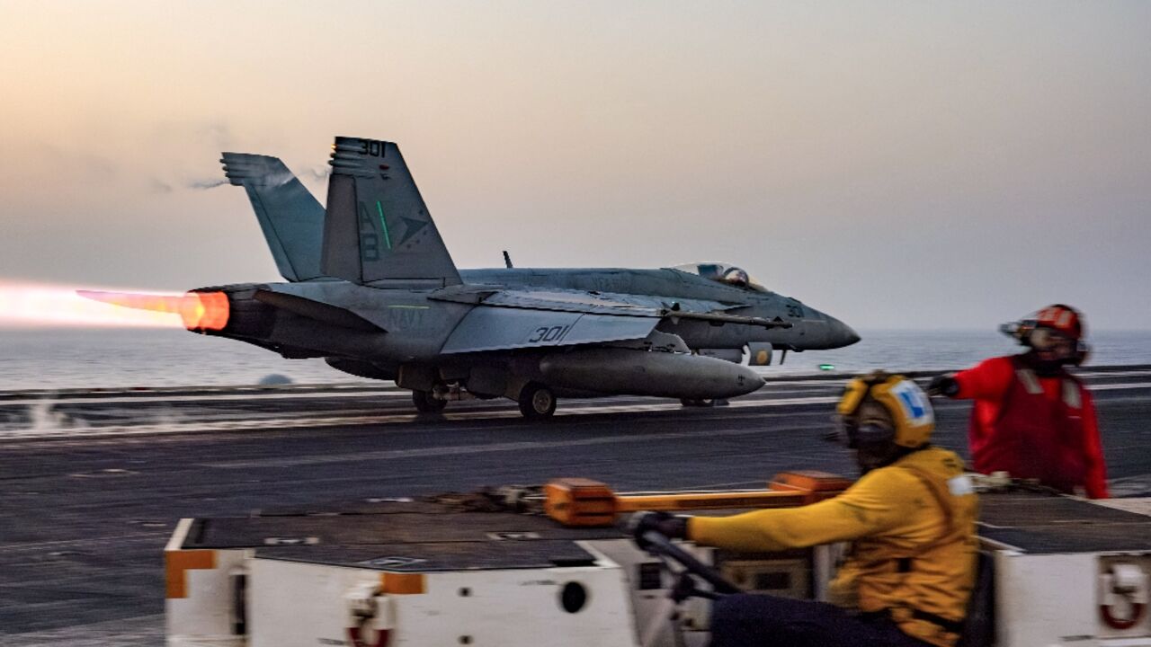 A US military photo shows an F/A-18 Super Hornet warplane taking off from the USS Harry S. Truman aircraft carrier on March 16, 2025 A US military photo shows an F/A-18 Super Hornet warplane taking off from the USS Harry S. Truman aircraft carrier on March 16, 2025