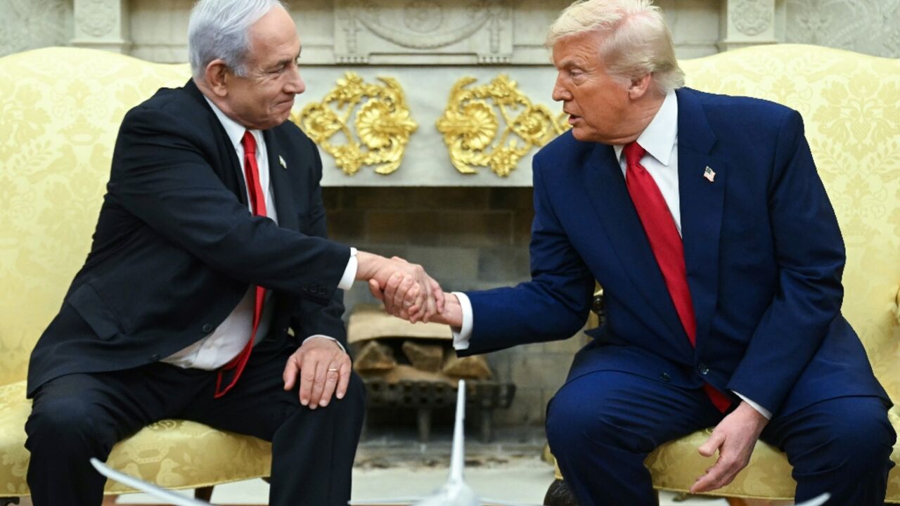 US President Donald Trump shakes hands with Israeli Prime Minister Benjamin Netanyahu during a meeting in the Oval Office of the White House in Washington, DC, on April 7, 2025. Israeli Prime Minister Benjamin Netanyahu was in Washington on Monday to meet Donald Trump, whom he will likely ask for a reprieve from US tariffs while seeking further backing on Iran and Gaza.