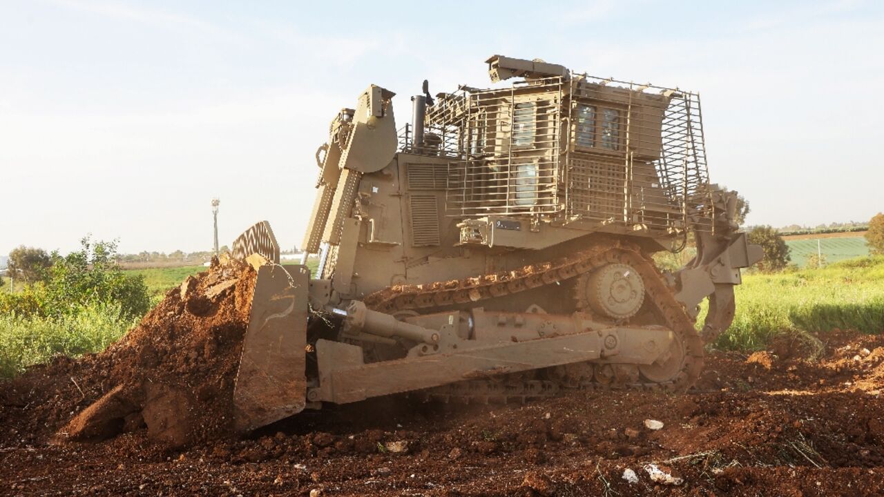 An unmanned D9 bulldozer digs up a field during a demonstration to the press at the Israel Aerospace Industries headquarters An unmanned D9 bulldozer digs up a field during a demonstration to the press at the Israel Aerospace Industries headquarters