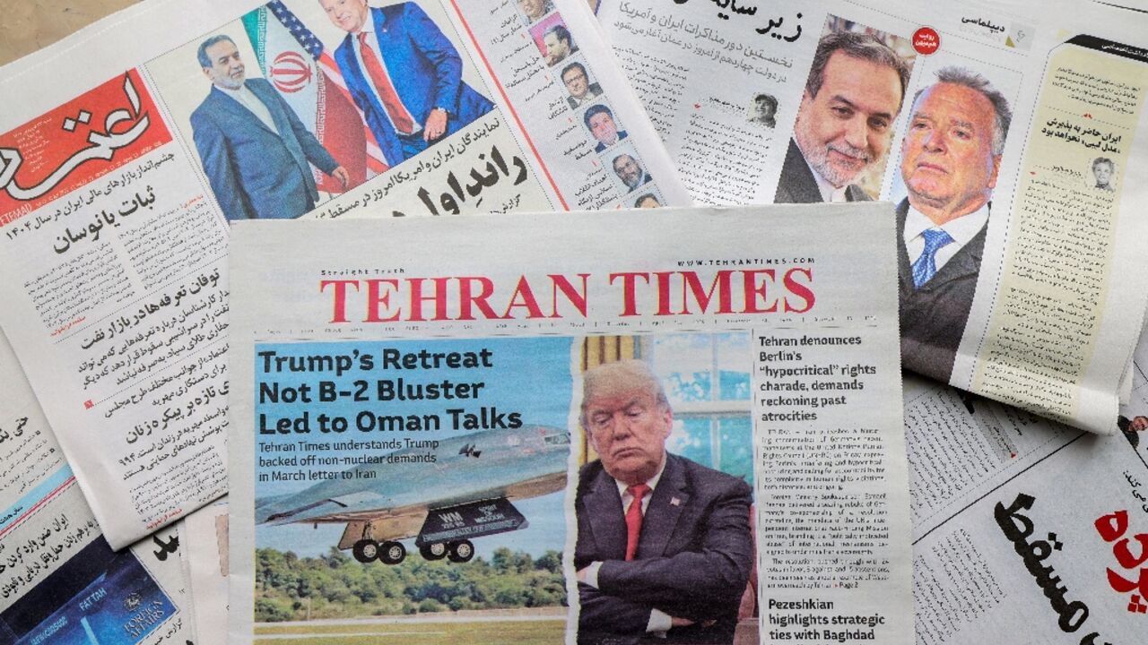 Newspaper front pages featuring the expected Iran-US nuclear talks are displayed at a kiosk in Tehran Newspaper front pages featuring the expected Iran-US nuclear talks are displayed at a kiosk in Tehran
