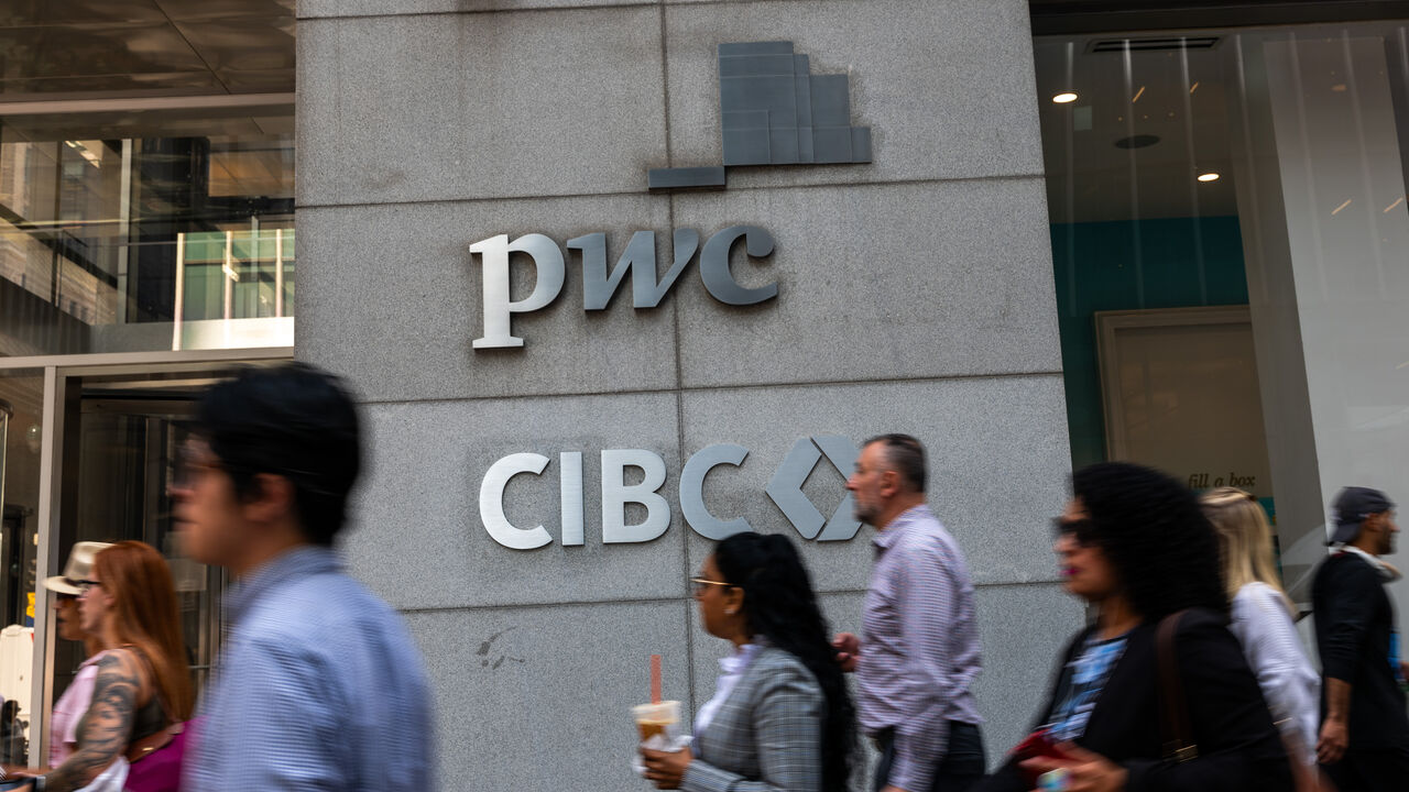 NEW YORK, NEW YORK - SEPTEMBER 12: People walk by PricewaterhouseCoopers (PwC) New York headquarters after the company announced a major restructuring on September 12, 2024 in New York City. PwC LLP will let go of up to 1,800 US employees next month as the accounting firm shifts to in-house technology developers and streamlines its advisory practice. (Photo by Spencer Platt/Getty Images)