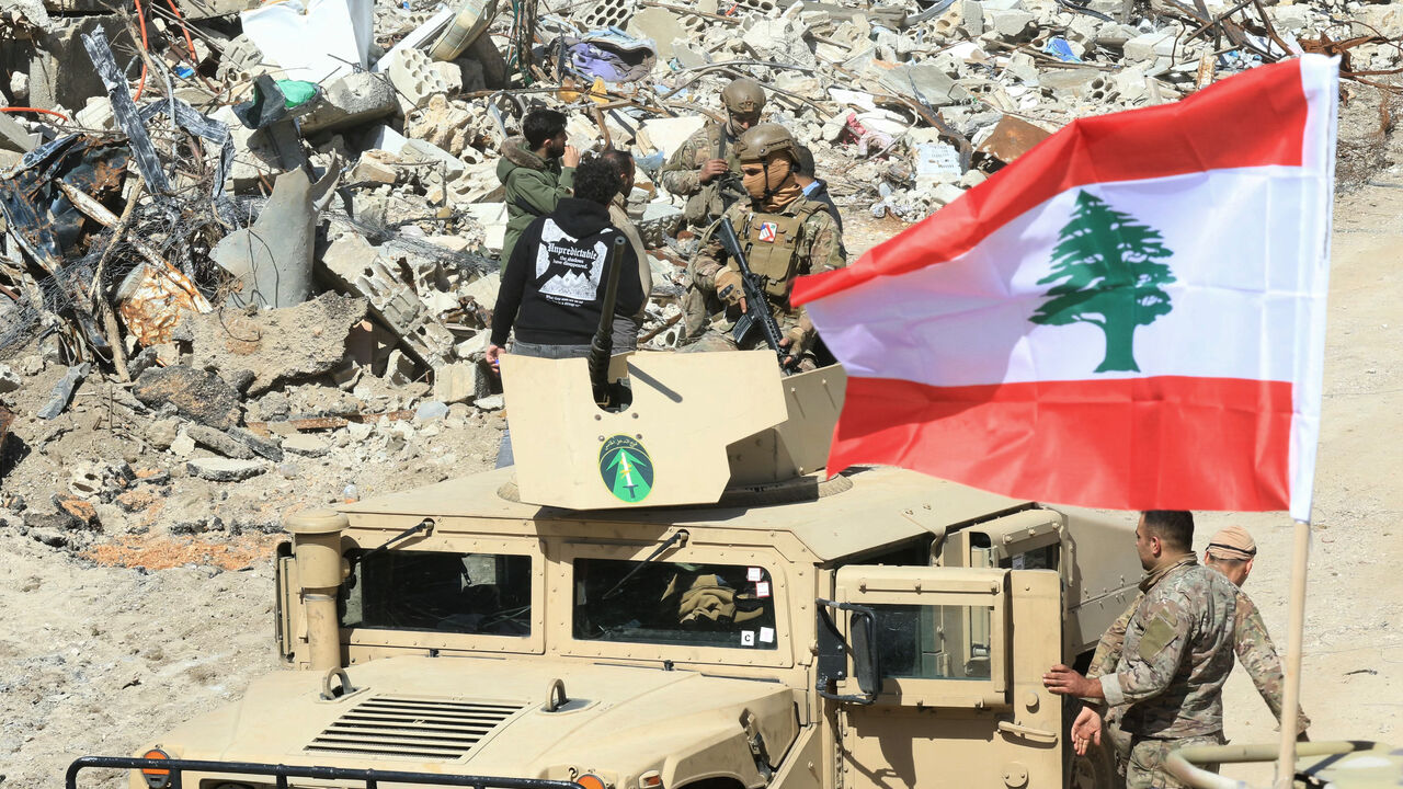 Lebanese army troops patrol the destroyed southern border village of Adaisseh, following the Israeli forces withdrawal on February 18, 2025. Lebanon's army said it deployed in southern border villages and areas vacated by Israeli troops on February 18, as a withdrawal deadline expired under a truce between Israel and Hezbollah. (Photo by Mahmoud ZAYYAT / AFP) (Photo by MAHMOUD ZAYYAT/AFP via Getty Images)