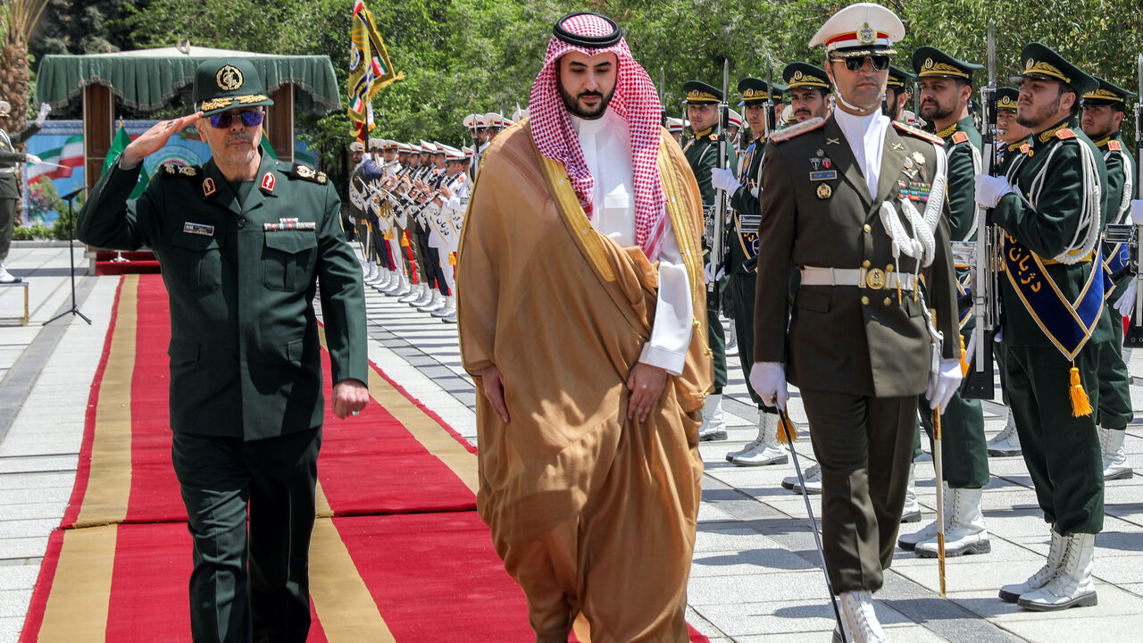This handout photo made available by the Iranian Army Office on April 17, 2025 shows Iran's Armed Forces Chief of Staff Major-General Mohammed Bagheri (L) receiving Saudi Arabia's Defense Minister Prince Khalid bin Salman (C) in Tehran on April 17, 2025. 