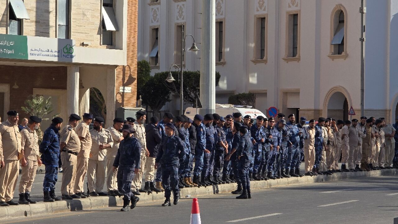 Libyan security forces line the streets as protesters gather in the capital's Martyrs' Square after days of deadly clashes to call for the resignation of the Tripoli government. Libyan security forces line the streets as protesters gather in the capital's Martyrs' Square after days of deadly clashes to call for the resignation of the Tripoli government.