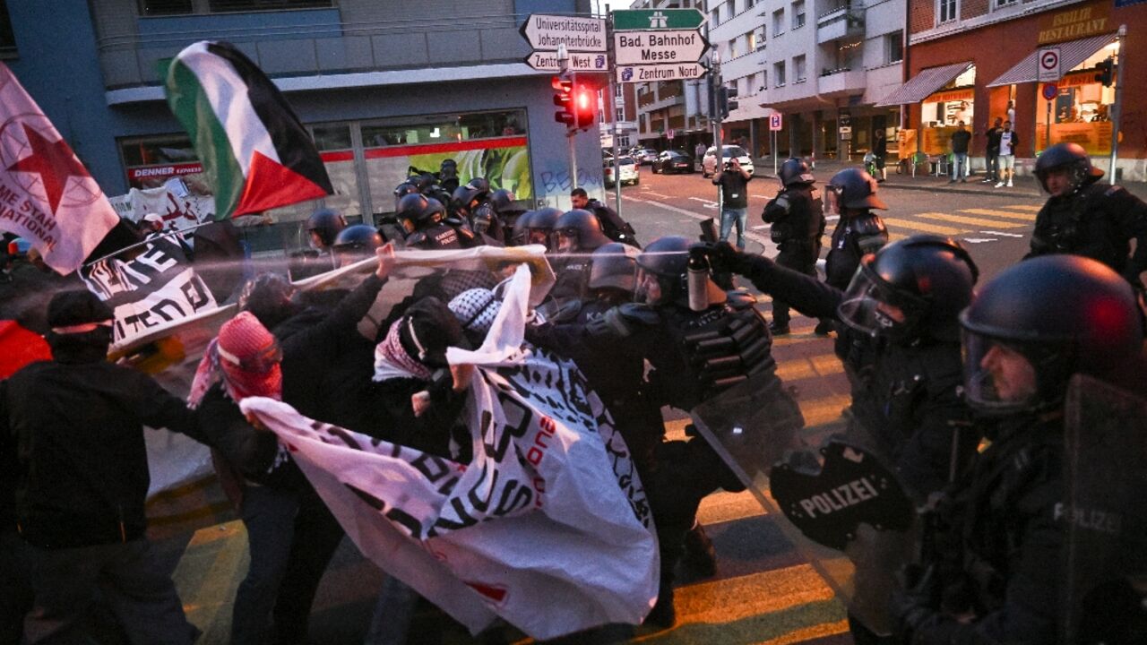 Anti-riot police officers used pepper spray to restrain activists during a demonstration against Israel's participation in Eurovision Anti-riot police officers used pepper spray to restrain activists during a demonstration against Israel's participation in Eurovision