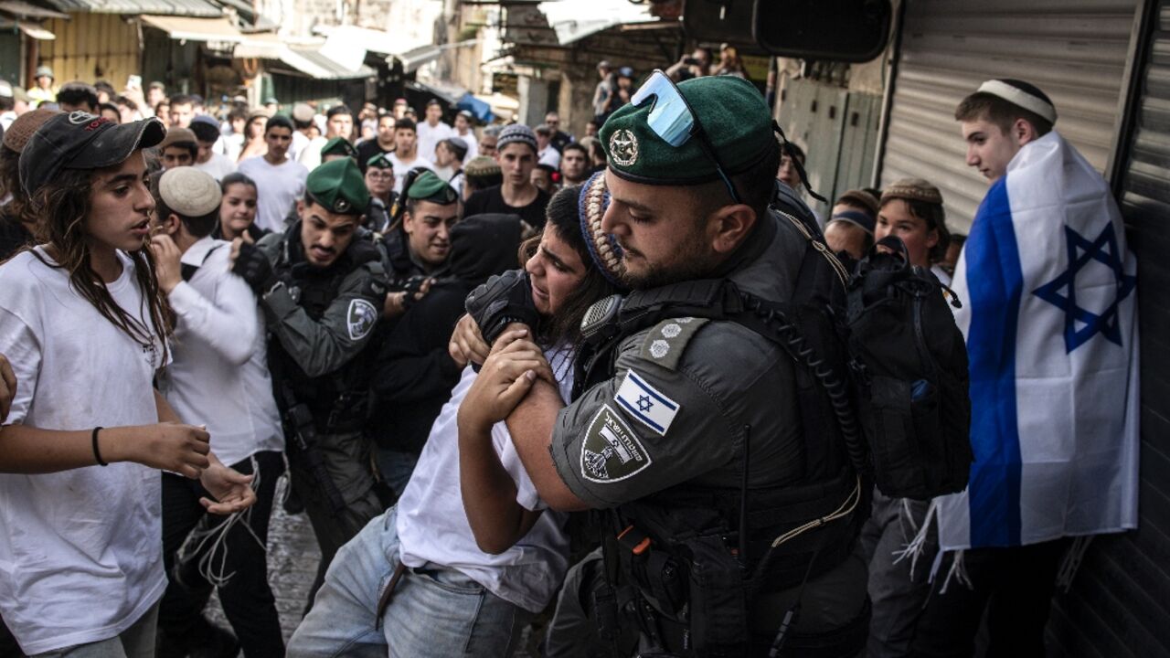 Israeli police tussle with a young man in the Old City during a march for Jerusalem Day on Monday Israeli police tussle with a young man in the Old City during a march for Jerusalem Day on Monday