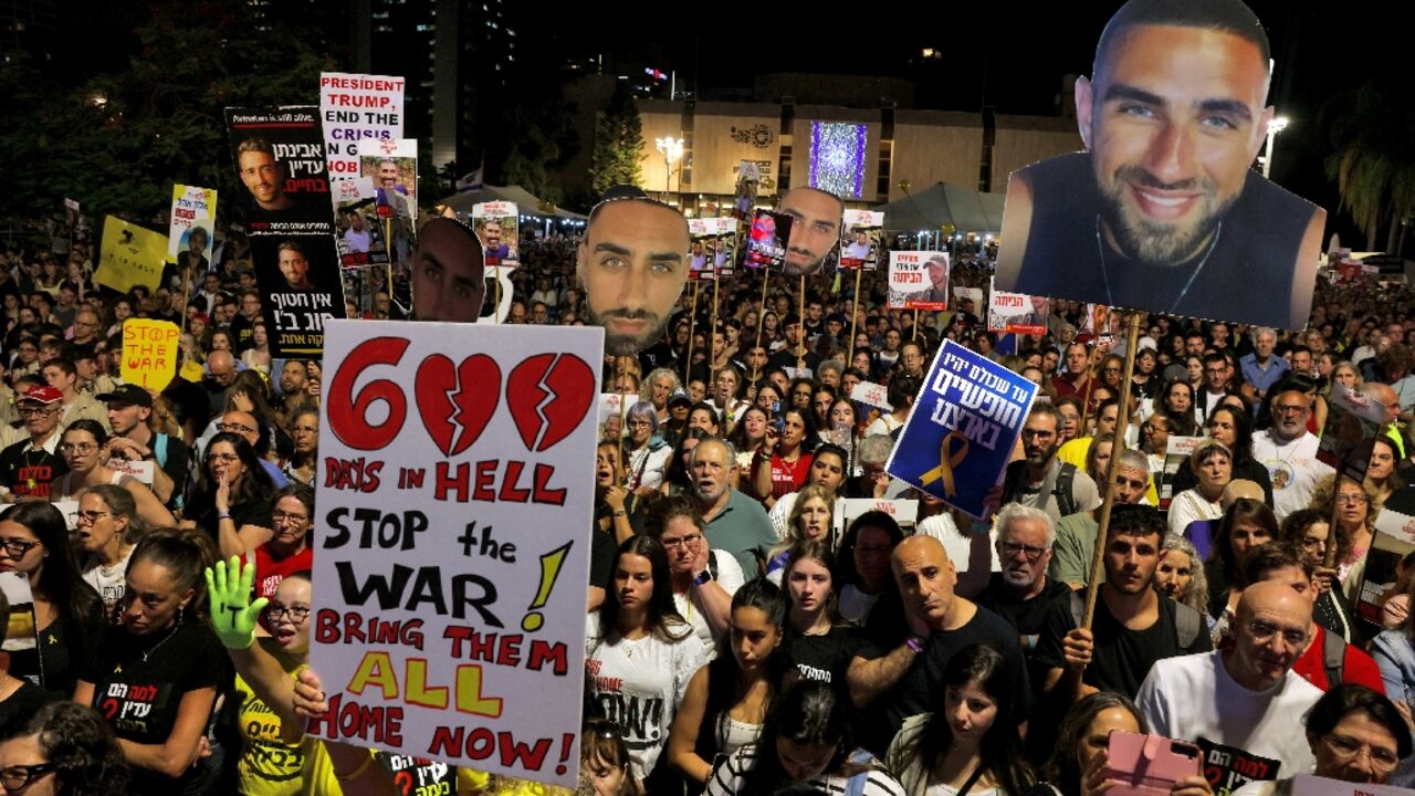 Relatives and supporters of hostages held in Gaza since October 7 hold their portraits during a protest at Hostages Square in Tel Aviv Relatives and supporters of hostages held in Gaza since October 7 hold their portraits during a protest at Hostages Square in Tel Aviv