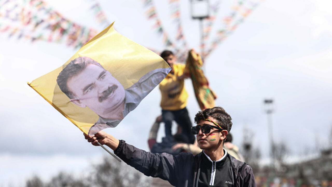 A Kurdish youth holds a poster of jailed PKK militant group leader Abdullah Ocalan during Newroz celebrations on March 21, 2025 in Diyarbakir, Turkey. Newroz, or Nowruz, a celebration of the spring equinox and Persian new year, is observed by a diverse array of communities across western and central Asia, including Kurdish areas of Turkey, Syria and Iraq. Newroz is the most important festival in Kurdish culture and has taken the form of political expression among Kurds in Turkey. (Photo by Sedat Suna/Getty