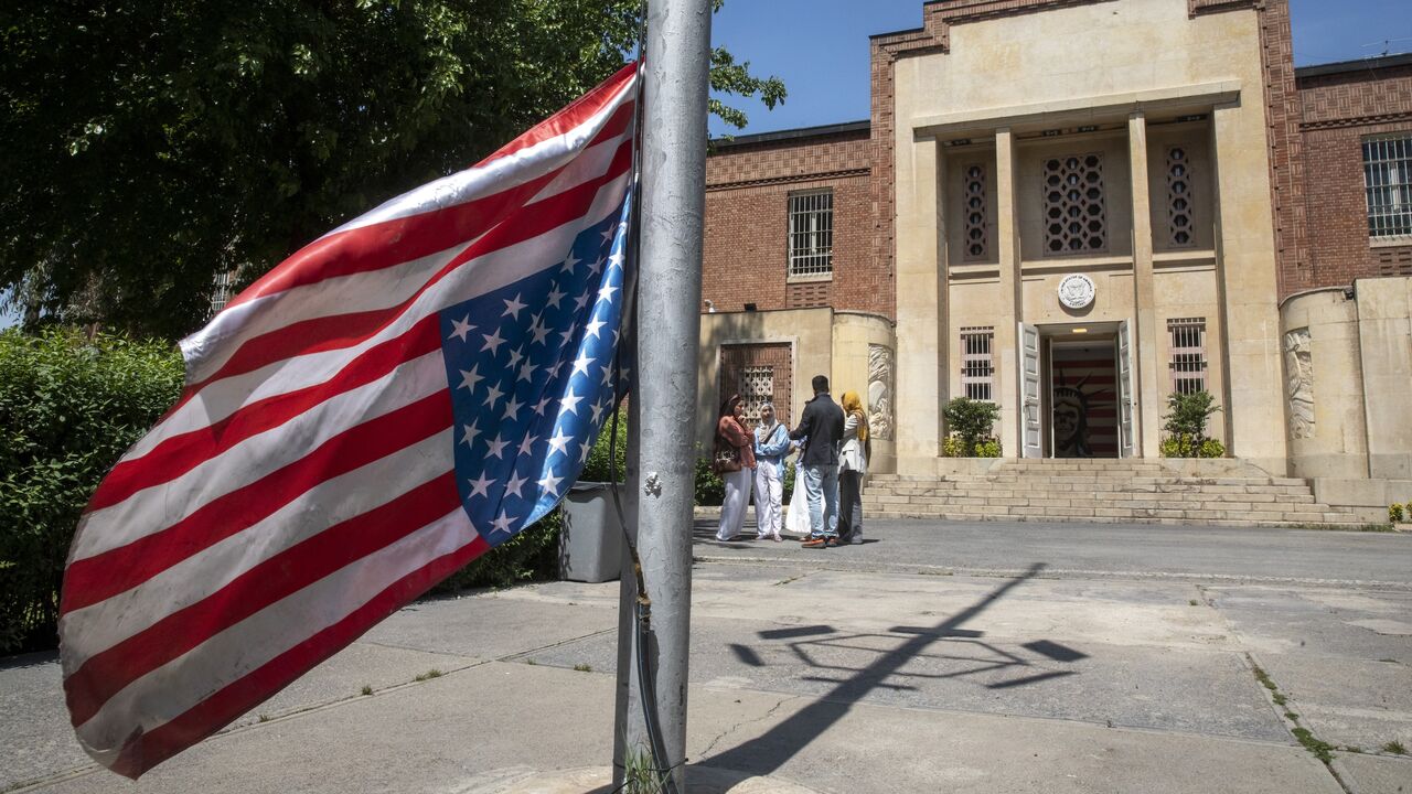 The US flag is seen hung upside down at the former US Embassy in downtown Tehran on April 19, 2025, in Tehran, Iran.