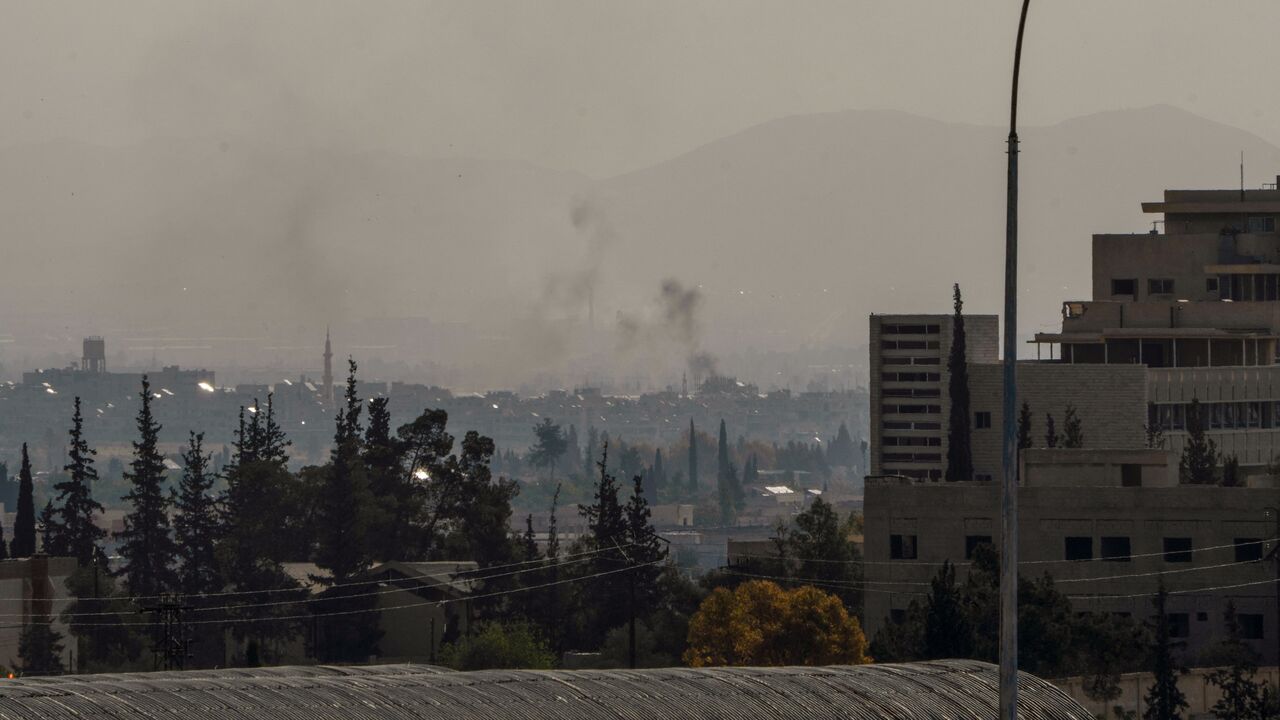 Smoke billows near a military hospital in Harasta, northeast Damascus, following Israeli airstrikes across Syria overnight on May 3, 2025.