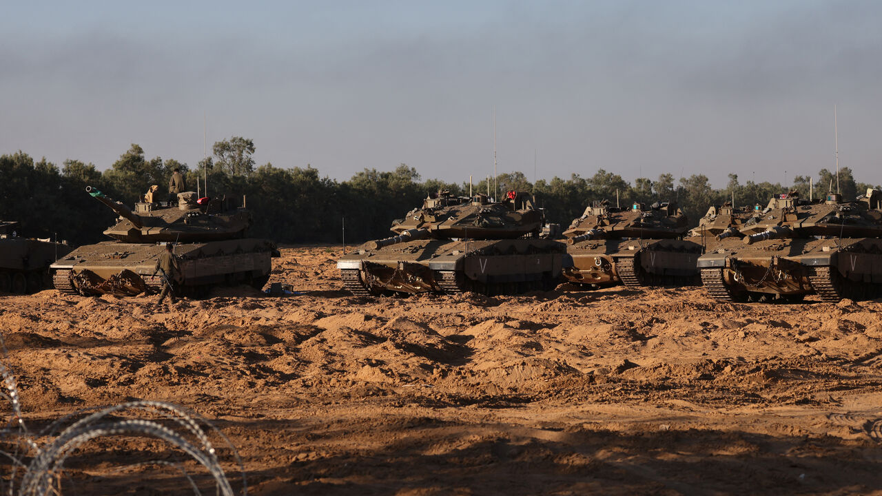 Israeli army tanks are deployed at a position near Israel's border with the Gaza Strip, on May 5, 2025. Israel was issuing orders to call up tens of thousands of reservists ahead of an expanded offensive in Gaza, Israeli media reported on May 3, as Prime Minister Benjamin Netanyahu attacked truce mediator Qatar. (Photo by Menahem KAHANA / AFP) (Photo by MENAHEM KAHANA/AFP via Getty Images)