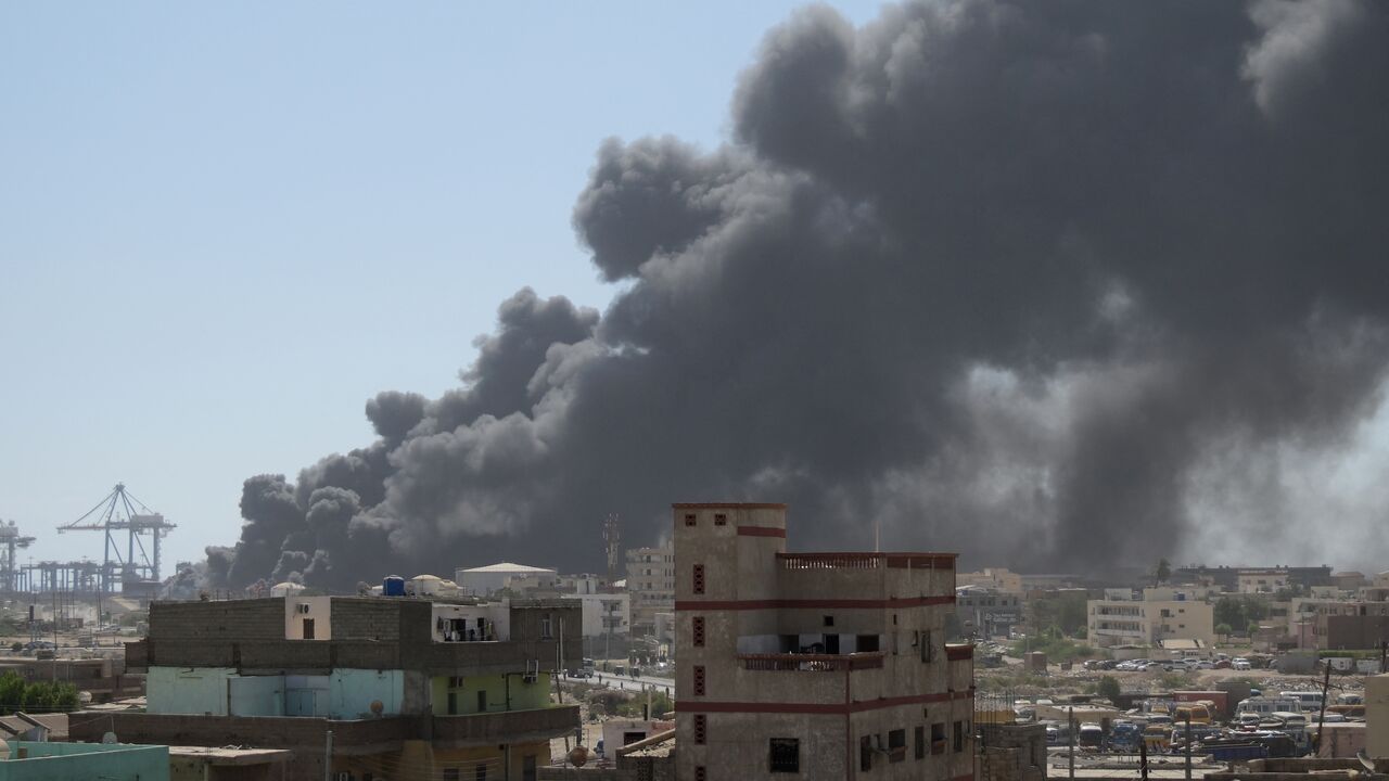 Smoke billows after a drone strike on the port of Port Sudan on May 6, 2025.