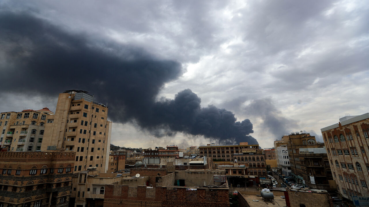 Smoke billows on the horizon following an Israeli air strike on Yemen's Houthi-held capital Sanaa on May 6, 2025.