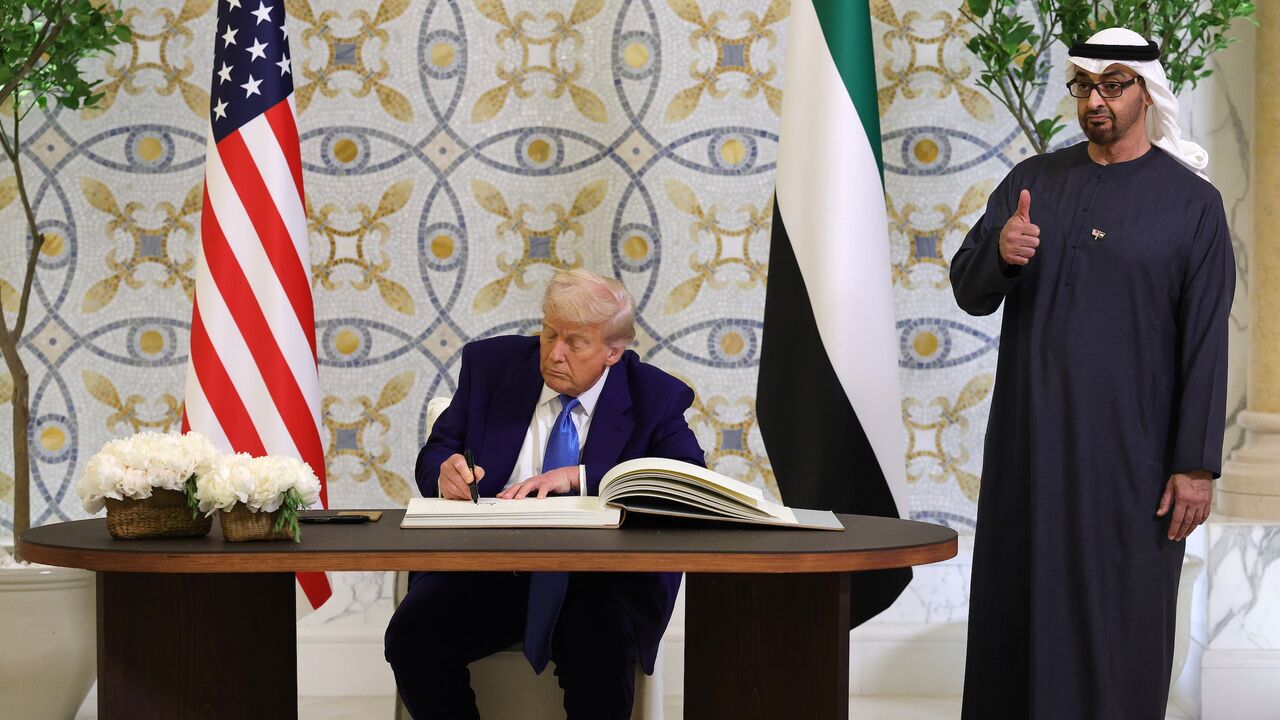 US President Donald J. Trump signs the guestbook as UAE President Sheikh Mohamed bin Zayed Al Nahyan looks on and gives a thumbs up gesture after a meeting at Qasr al-Watan (Palace of the Nation), Abu Dhabi, United Arab Emirates, May 15, 2025.