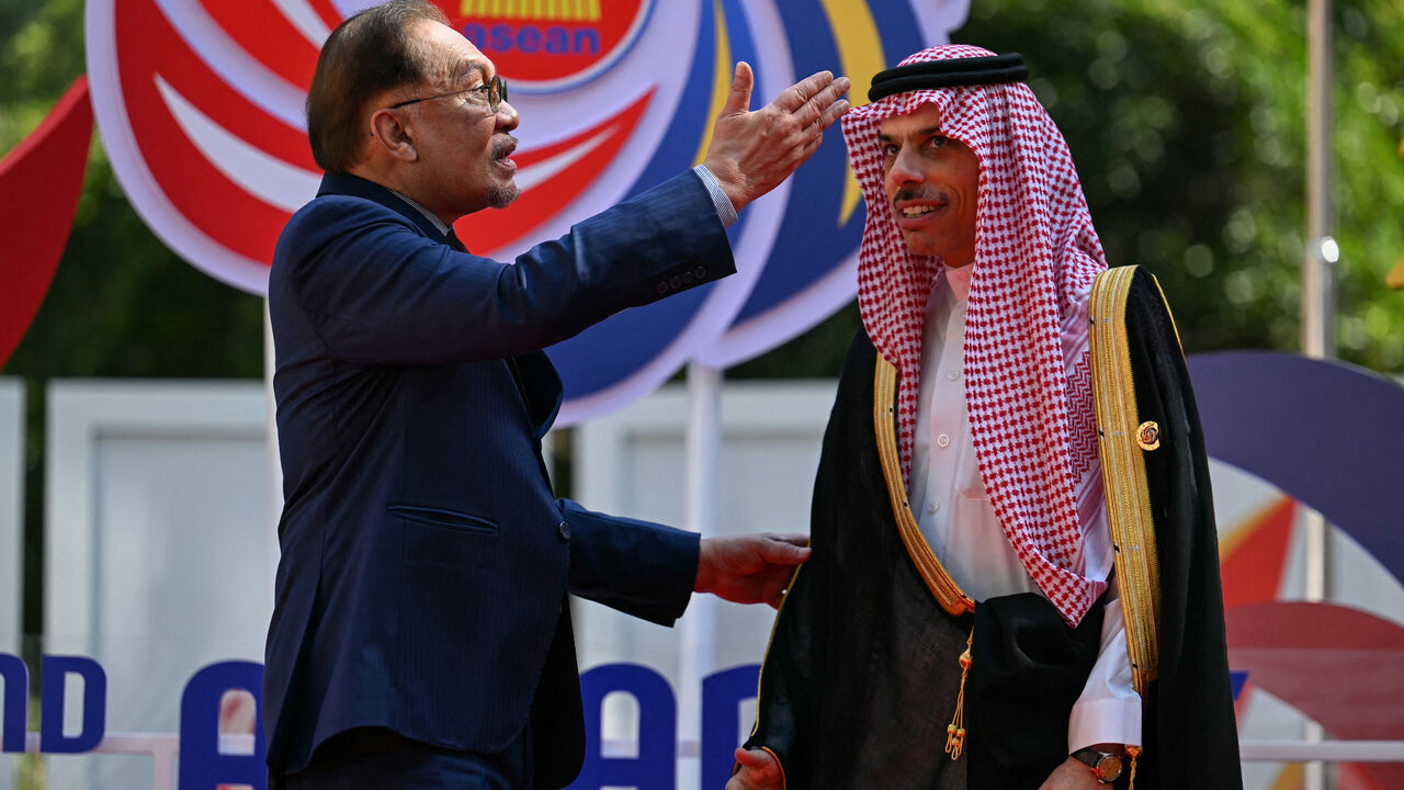 Malaysia's Prime Minister Anwar Ibrahim (L) greets Saudi Arabia's Foreign Minister Prince Faisal bin Farhan al-Saud as he arrives for the 2nd ASEAN-Gulf Cooperation Council (GCC) Summit after the 46th Association of Southeast Asian Nations (ASEAN) Summit in Kuala Lumpur on May 27, 2025.