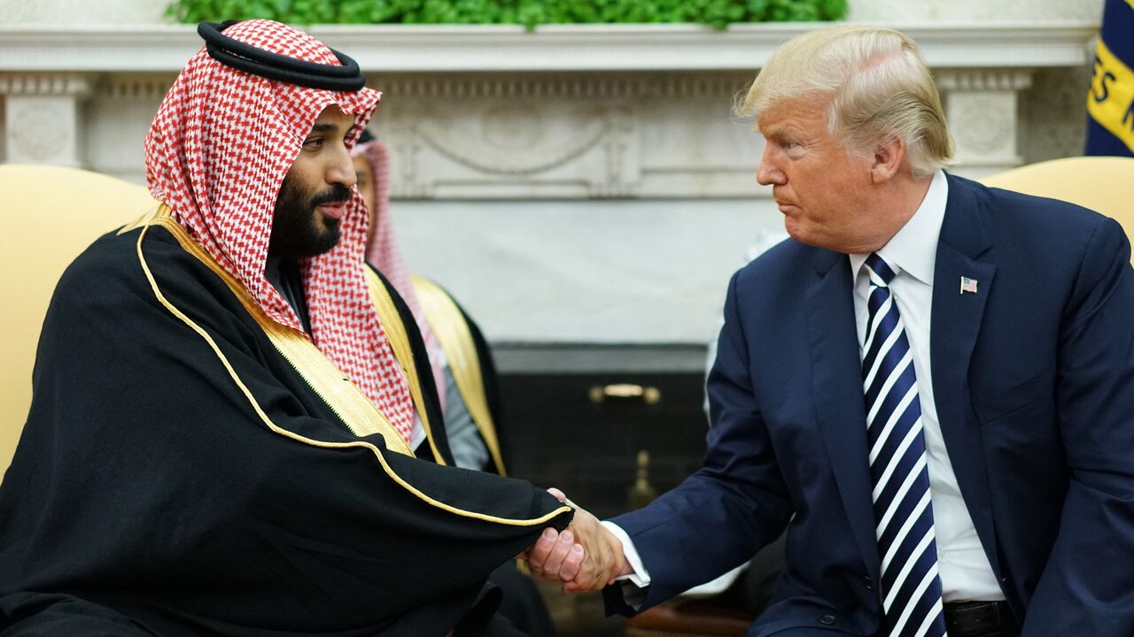 President Donald Trump shakes hands with Saudi Arabia's crown prince, Mohammed bin Salman, in the Oval Office of the White House on March 20, 2018.