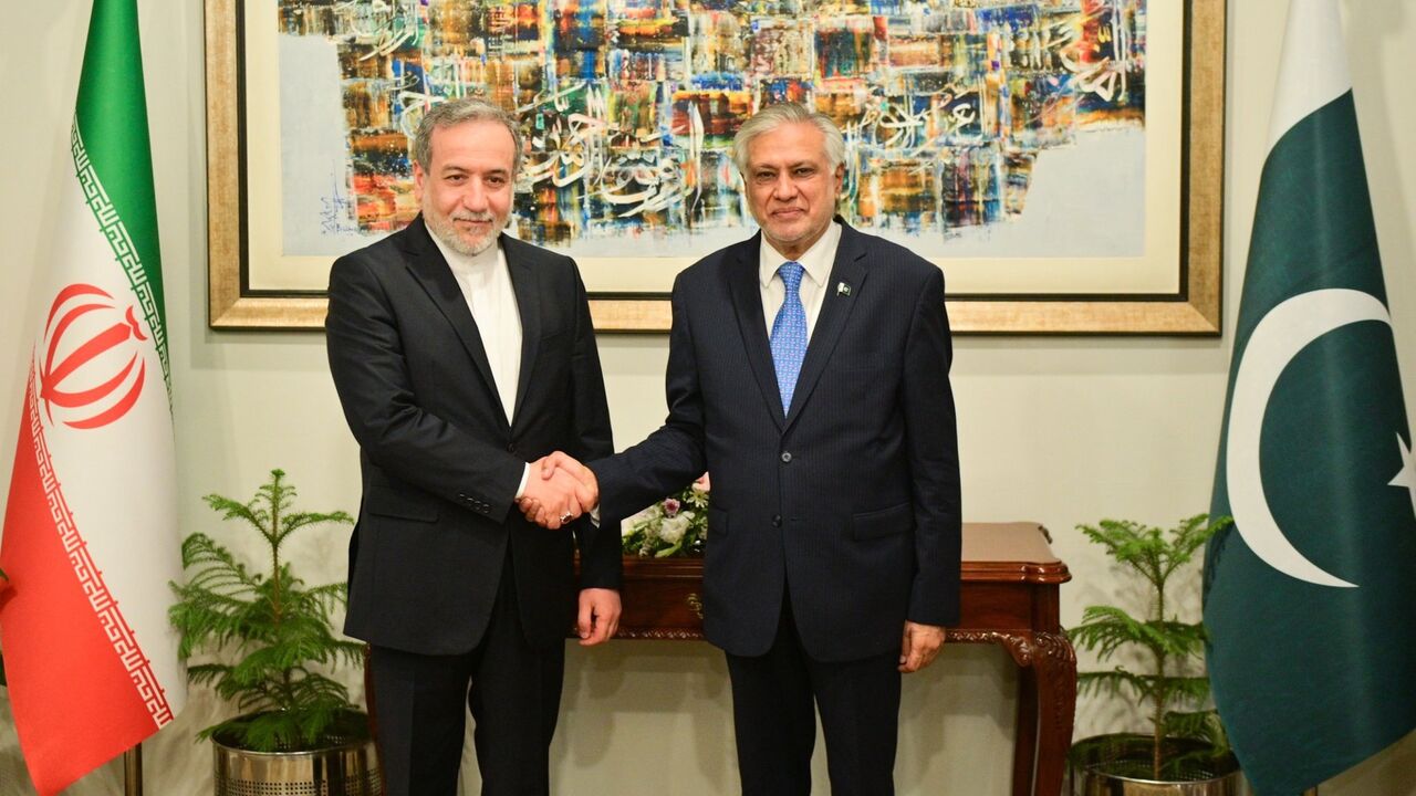 Iranian Foreign Minister Abbas Araghchi (L) meets with his Pakistani counterpart Mohammad Ishaq Dar in Islamabad on May 5, 2025.