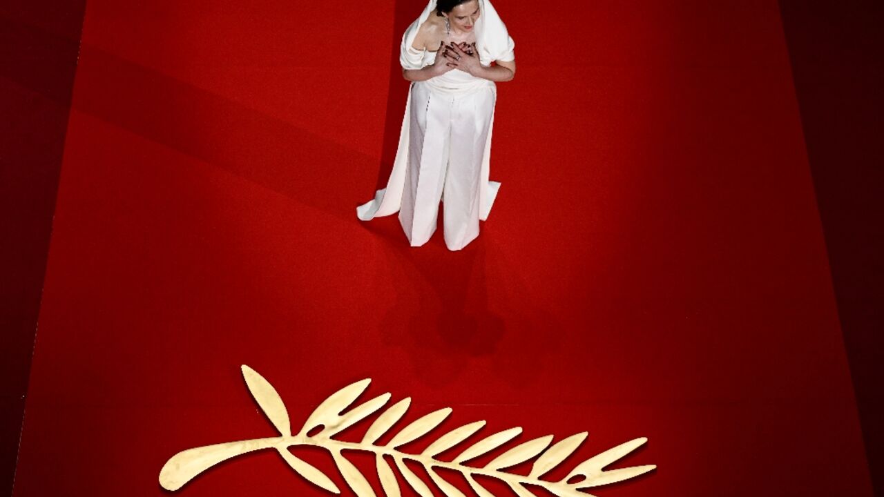 French actress Binoche arrives on stage during the opening ceremony French actress Binoche arrives on stage during the opening ceremony