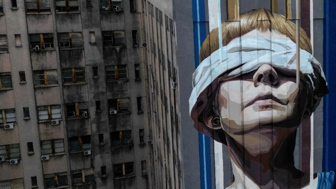 A Buenos Aires mural in honor of the 85 dead and more than 300 wounded in an 1994 attack on the Jewish community center of the Mutual Israelite Association of Argentina (AMIA) A Buenos Aires mural in honor of the 85 dead and more than 300 wounded in an 1994 attack on the Jewish community center of the Mutual Israelite Association of Argentina (AMIA)