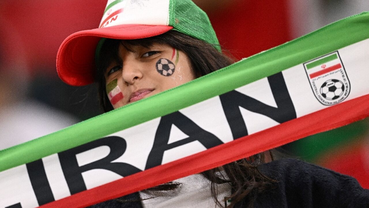 An Iran fan supports her team at a game against the US side at the Qatar 2022 World Cup An Iran fan supports her team at a game against the US side at the Qatar 2022 World Cup