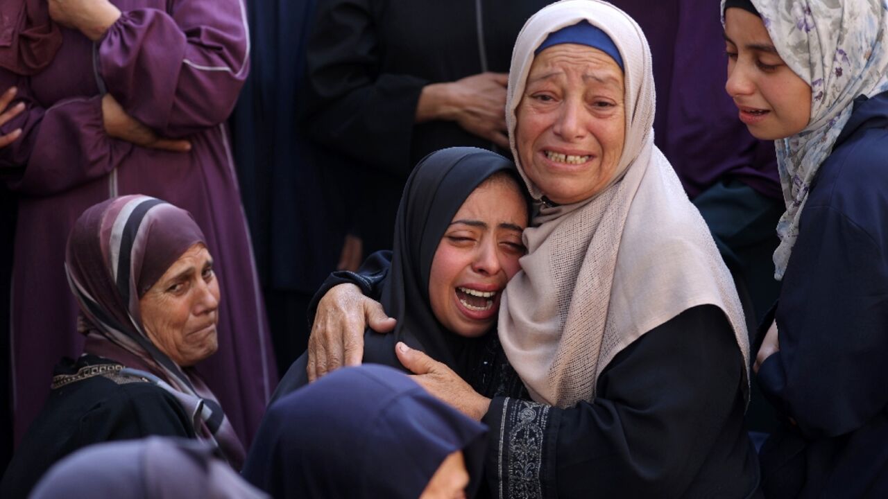 Mourners at a hospital in Gaza City cried over the bodies of people killed in an Israeli strike in nearby Jabalia Mourners at a hospital in Gaza City cried over the bodies of people killed in an Israeli strike in nearby Jabalia
