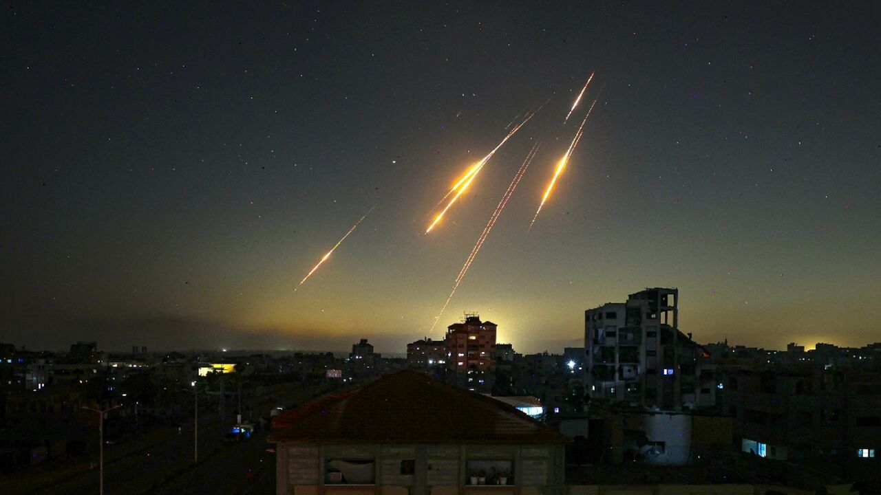 Missiles streak across the sky in this picture taken from Nuseirat in the central Gaza Strip late on June 13, 2025 Missiles streak across the sky in this picture taken from Nuseirat in the central Gaza Strip late on June 13, 2025