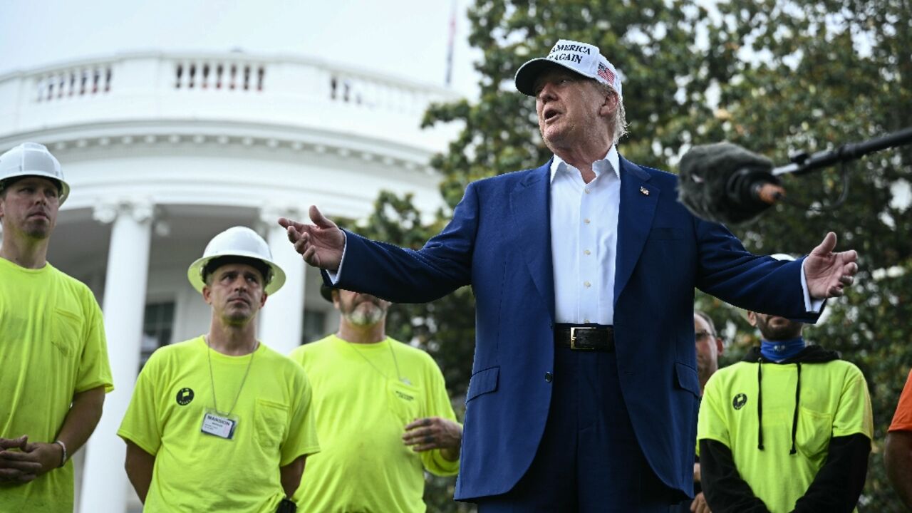 US President Donald Trump speaks to the press as workers install a large flag pole on the South Lawn of the White House in Washington, DC on June 18, 2025 US President Donald Trump speaks to the press as workers install a large flag pole on the South Lawn of the White House in Washington, DC on June 18, 2025