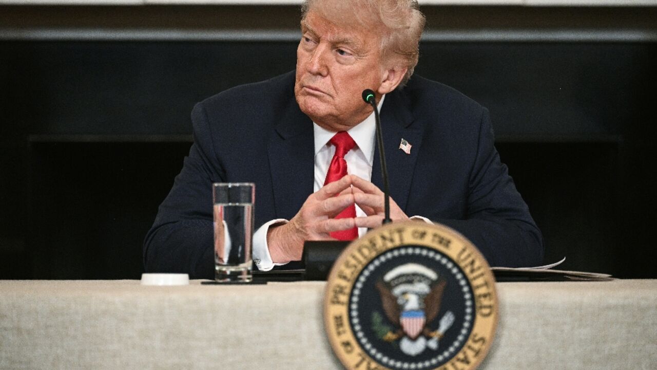 US President Donald Trump participates in an "Invest America" roundtable discussion in the State Dining Room of the White House US President Donald Trump participates in an "Invest America" roundtable discussion in the State Dining Room of the White House