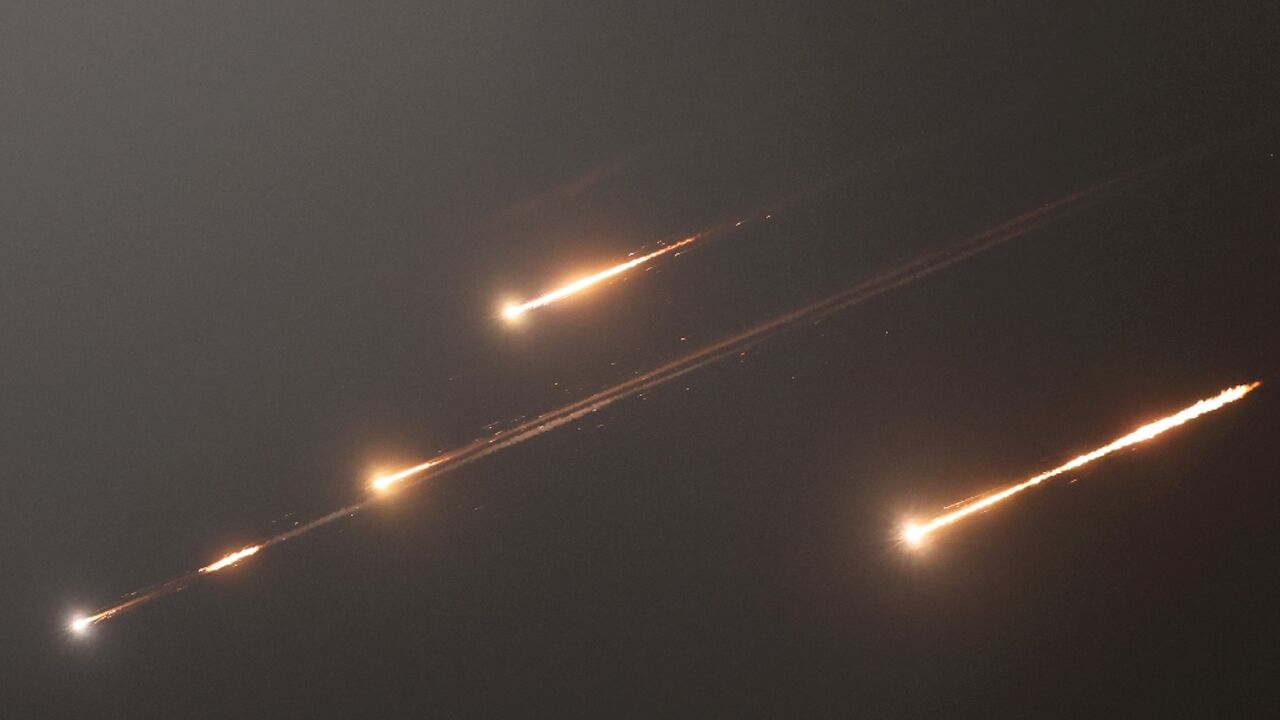 Rocket trails light up the skies over Jerusalem as Iran launches waves of missiles at Israel in response to its strikes on key nuclear and military facilities.