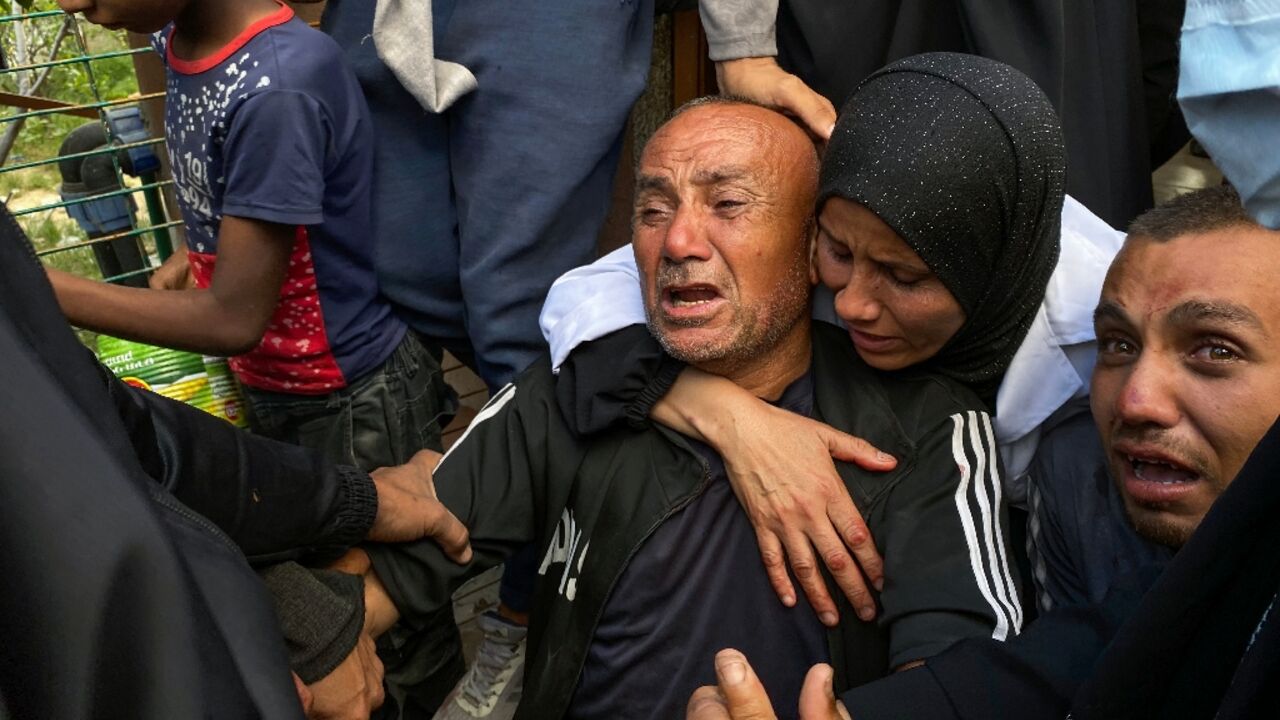 Palestinians mourn relatives killed near a US-backed aid center in the Rafah area, in the southern Gaza Strip Palestinians mourn relatives killed near a US-backed aid center in the Rafah area, in the southern Gaza Strip