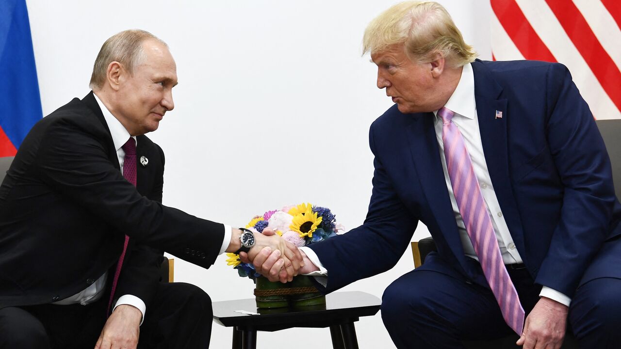 US President Donald Trump (R) attends a meeting with Russia's president, Vladimir Putin, during the G20 summit in Osaka on June 28, 2019.