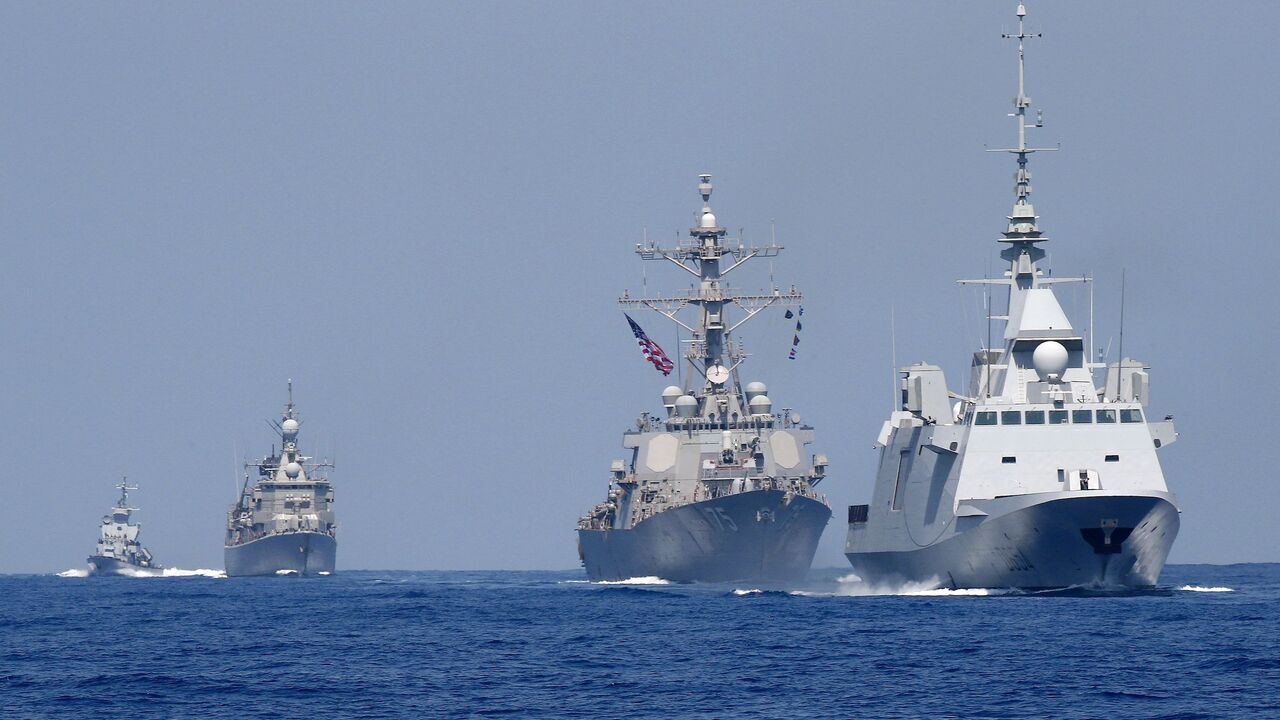 A photo taken on August 7, 2019, shows the French anti-submarine frigate FREMM Auvergne (R) and the US Navy USS Donald Cook class guided missile destroyer (2R) and the Greek HS Aigaion frigate (2L) during an exercise how simulate a humanitarian response to a powerful earthquake and significant movement of IDF vessels and foreign vessels in the Mediterranean sea.