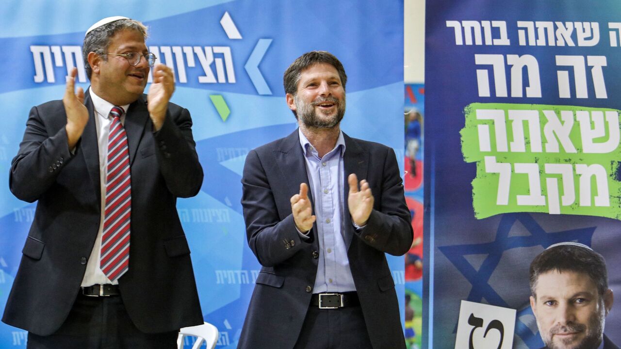 (L to R) Itamar Ben-Gvir, Israeli far-right lawmaker and leader of the Otzma Yehudit (Jewish power) party, and Bezalel Smotrich, Israeli far-right lawmaker and leader of the Religious Zionist Party, attend a rally with supporters in the southern Israeli city of Sderot on Oct. 26, 2022.
