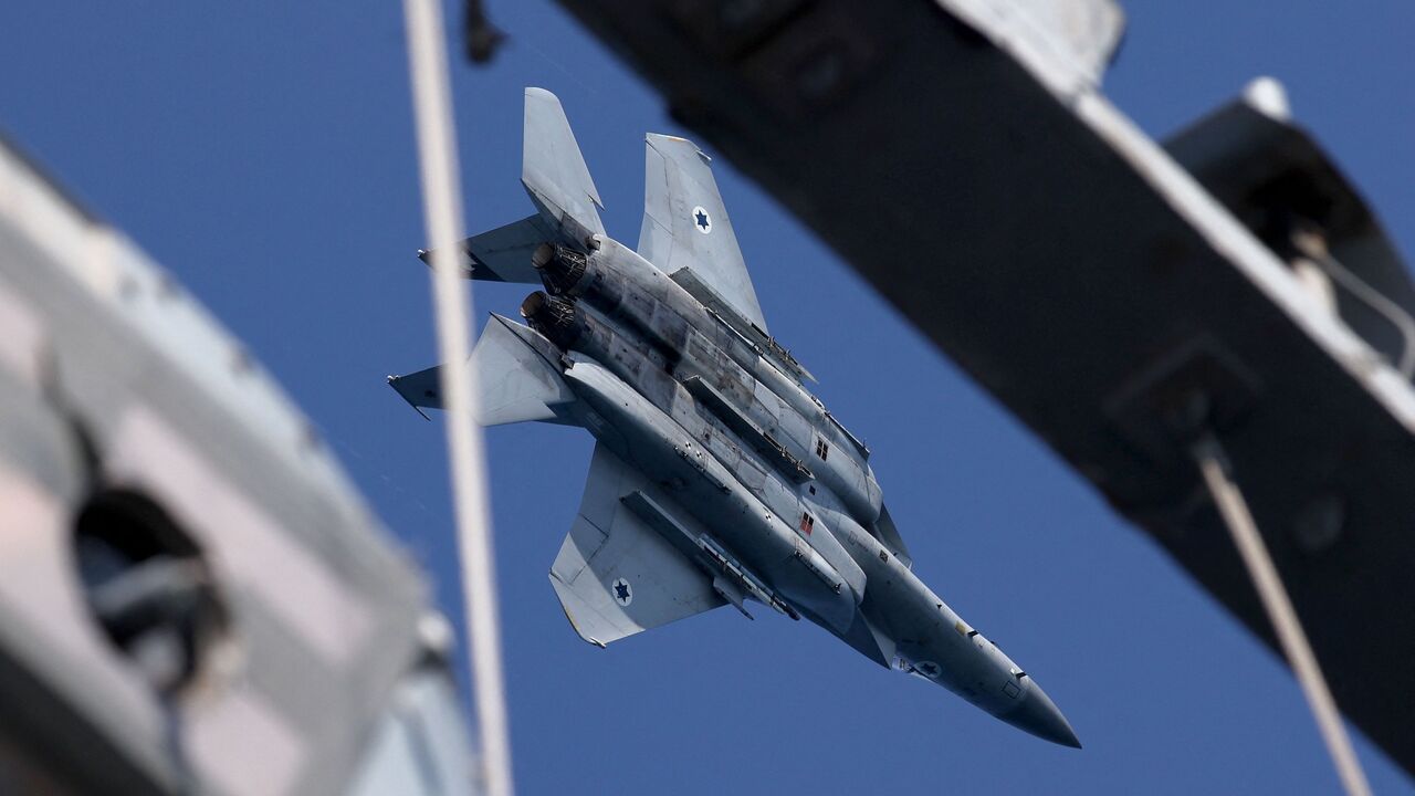 An Israeli F-15 Eagle fighter aircraft performs maneuvers during the "Noble Dina 23" multilateral aeronautical exercise over the Mediterranean sea on March 27, 2023.