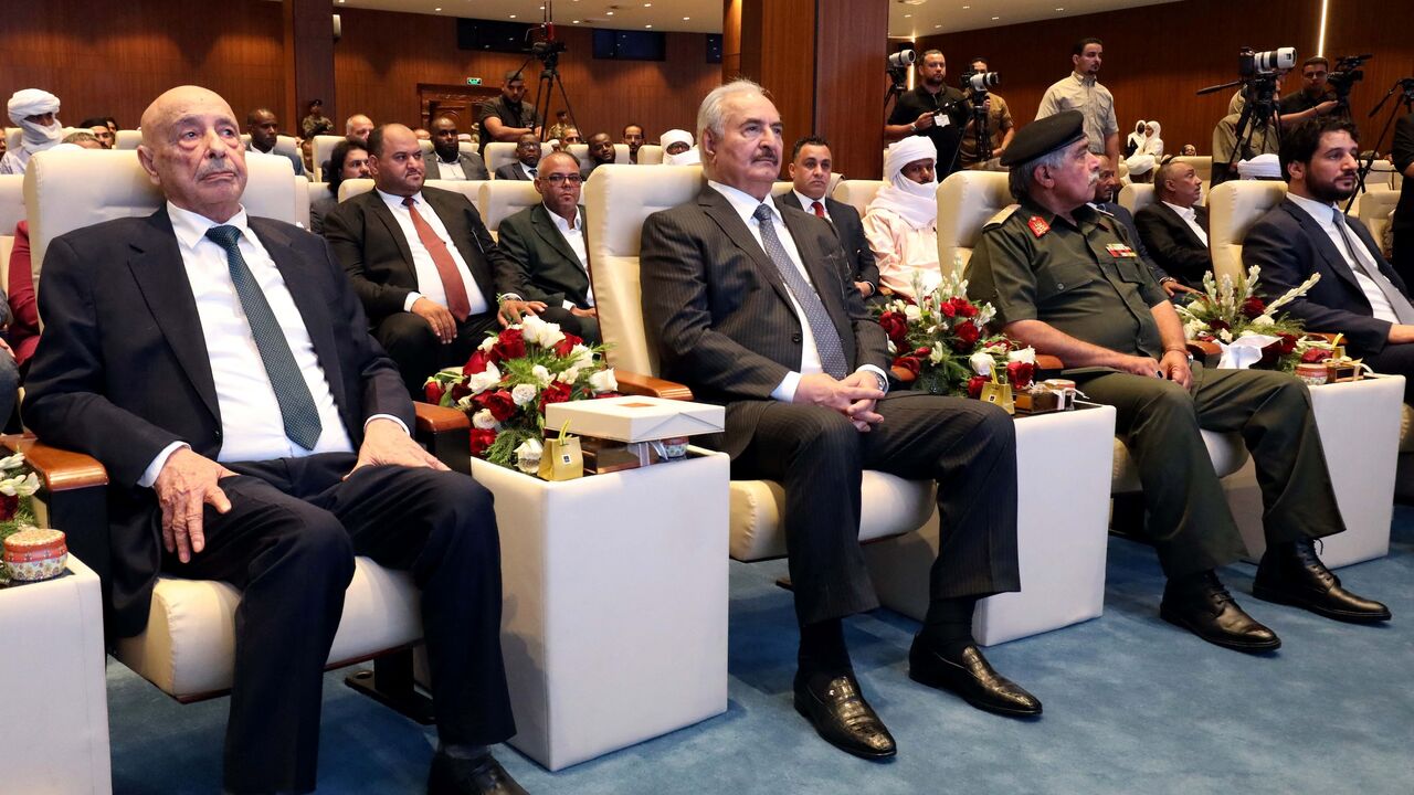 Libyan military strongman Khalifa Hifter (2nd L)