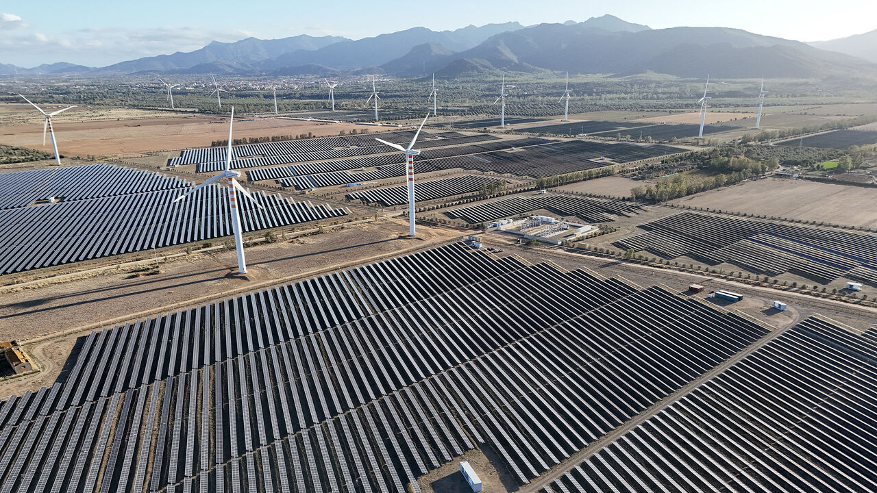 Wind turbines and solar pannels are seen on a campus near Cagliari on the island of Sardinia, Oct. 2, 2024.