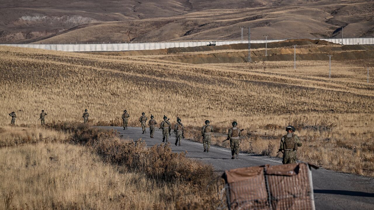 Turkish soldiers patrol near the border wall between Turkey and Iran in the Van Province, eastern Turkey, on Nov. 1, 2024. 