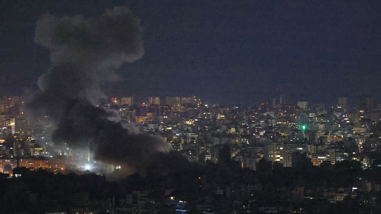 Smoke rises from the site of an Israeli air strike targeting the southern suburbs of Beirut, Nov. 23, 2024.