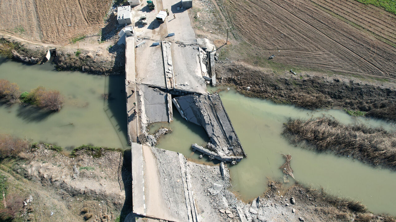 An aerial view shows a bridge, destroyed in an Israeli airstrike, in the town of in Qusayr in Syria's central Homs province on December 14, 2024. Islamist-led rebels took Damascus in a lightning offensive on December 8, ousting president Bashar al-Assad and ending five decades of Baath rule in Syria. (Photo by AAREF WATAD / AFP) (Photo by AAREF WATAD/AFP via Getty Images)