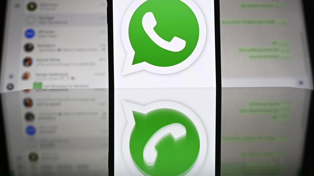 An illustration photograph taken on April 17, 2025 shows Whatsapp web displayed on a laptop screen with a phone displaying the Whatsapp logo, in a residential property in Guildford, south of London. (Photo by Justin TALLIS / AFP) (Photo by JUSTIN TALLIS/AFP via Getty Images)