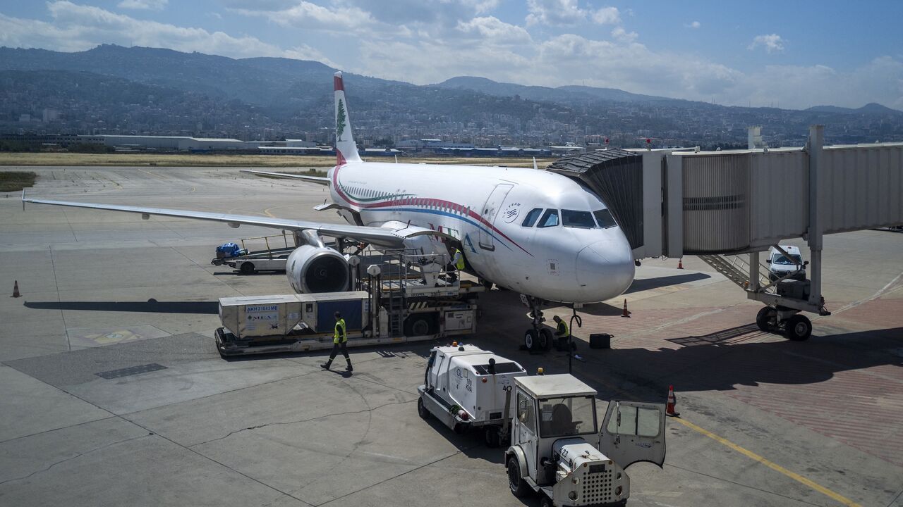 Ground staff prepare a Middle East Airlines flight for departure on the tarmac at Rafic Hariri International Airport in Beirut on May 2, 2025.