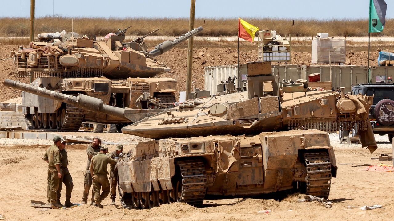 Israeli tanks are positioned along the border with the Gaza Strip, on June 5, 2025, amid the ongoing war between Israel and Hamas.