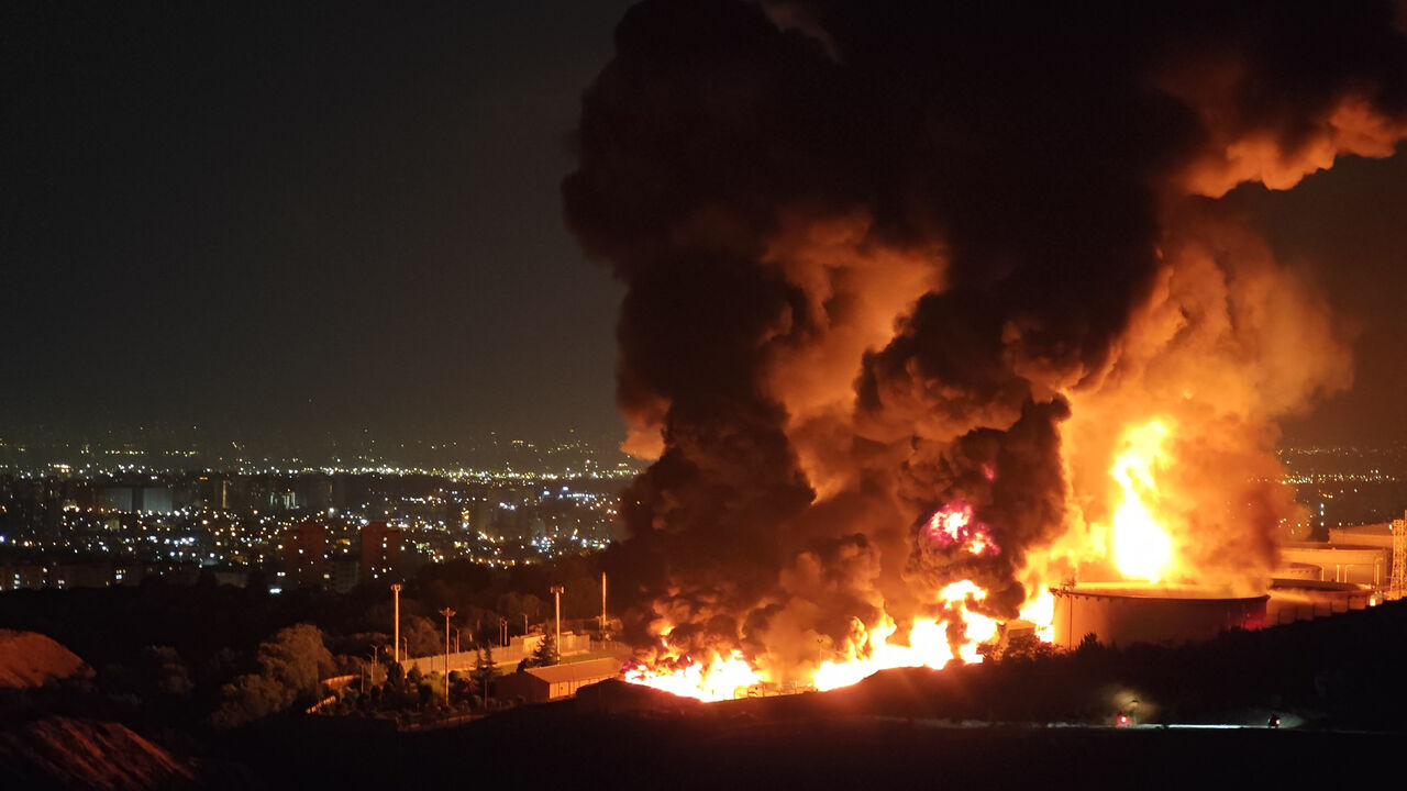 Fire and smoke rise into the sky after an Israeli attack on the Shahran oil depot, Tehran, Iran, June 15, 2025.