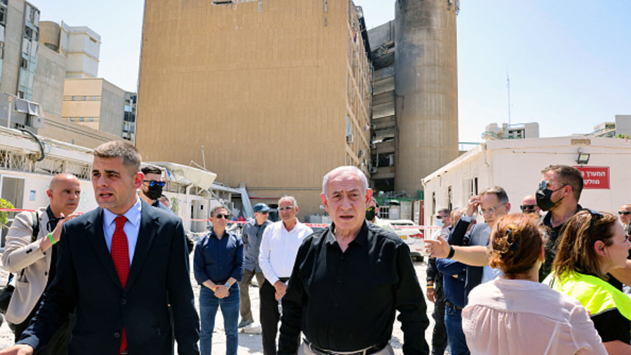 ISRAEL-IRAN-CONFLICT Israeli Prime Minister Benjamin Netanyahu visits the Soroka Hospital in the southern city of Beersheba, after it was hit by a missile fired from Iran on June 19, 2025. Israel's defence minister warned that Iran's supreme leader "can no longer be allowed to exist" after a hospital was hit in an Iranian missile strike on June 19, spiking tensions in the week-old war. (Photo by Marc Israel SELLEM / POOL / AFP) (Photo by MARC ISRAEL SELLEM/POOL/AFP via Getty Images)