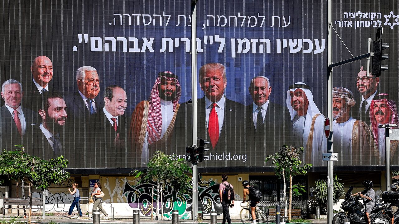 A billboard by the Coalition for Regional Security, with the Hebrew slogan which reads "A time for war, a time for settlement; now is the time for the 'Abrahamic Covenant,'" is displayed in Tel Aviv on June 26, 2025.