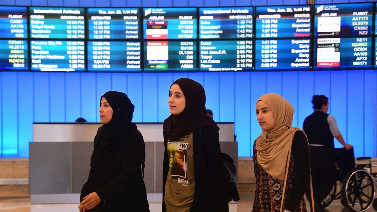 Travelers from the Middle East arrive at the International Arrivals section at Los Angeles International Airport on June 29, 2017.