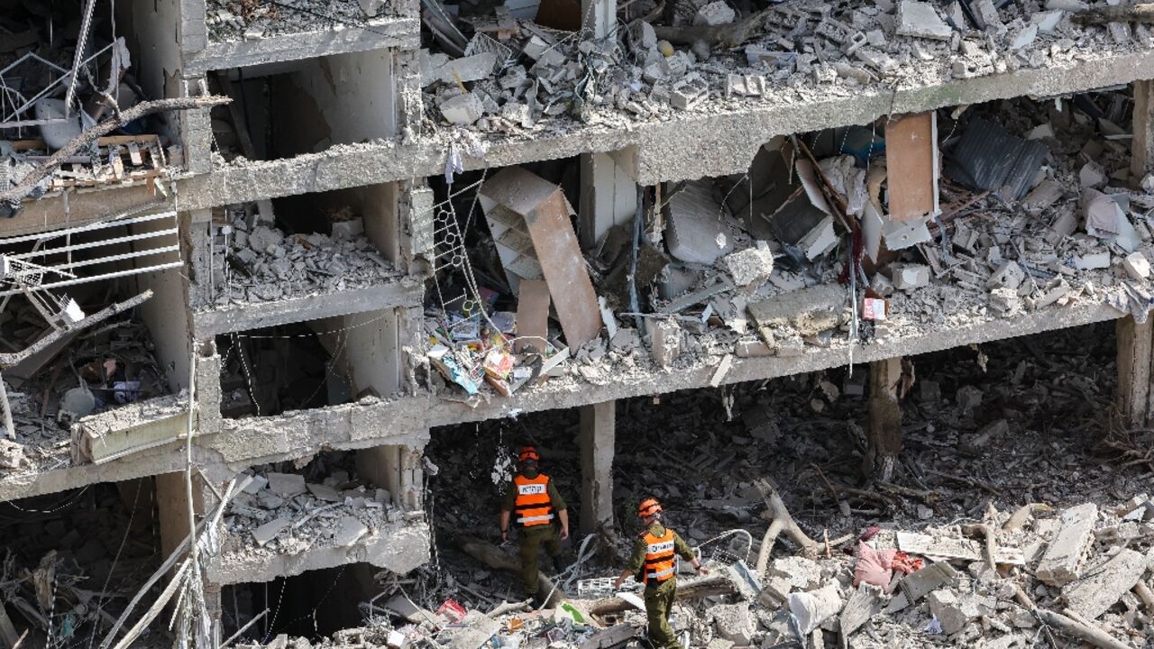 Israeli security forces and first responders gather at the site of an Iranian strike that hit a residential neighbourhood in the Ramat Aviv area in Tel Aviv Israeli security forces and first responders gather at the site of an Iranian strike that hit a residential neighbourhood in the Ramat Aviv area in Tel Aviv