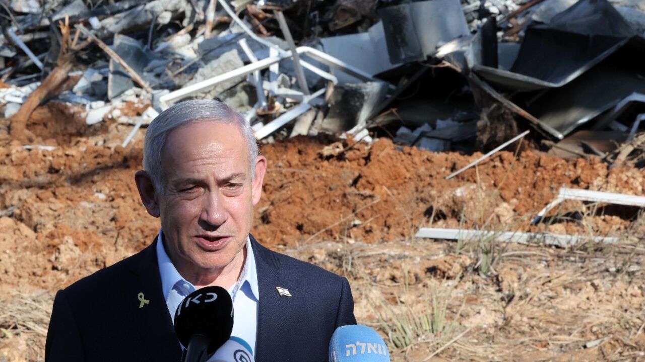 Israel's Prime Minister Benjamin Netanyahu at the site of a missile strike near Tel Aviv Israel's Prime Minister Benjamin Netanyahu at the site of a missile strike near Tel Aviv