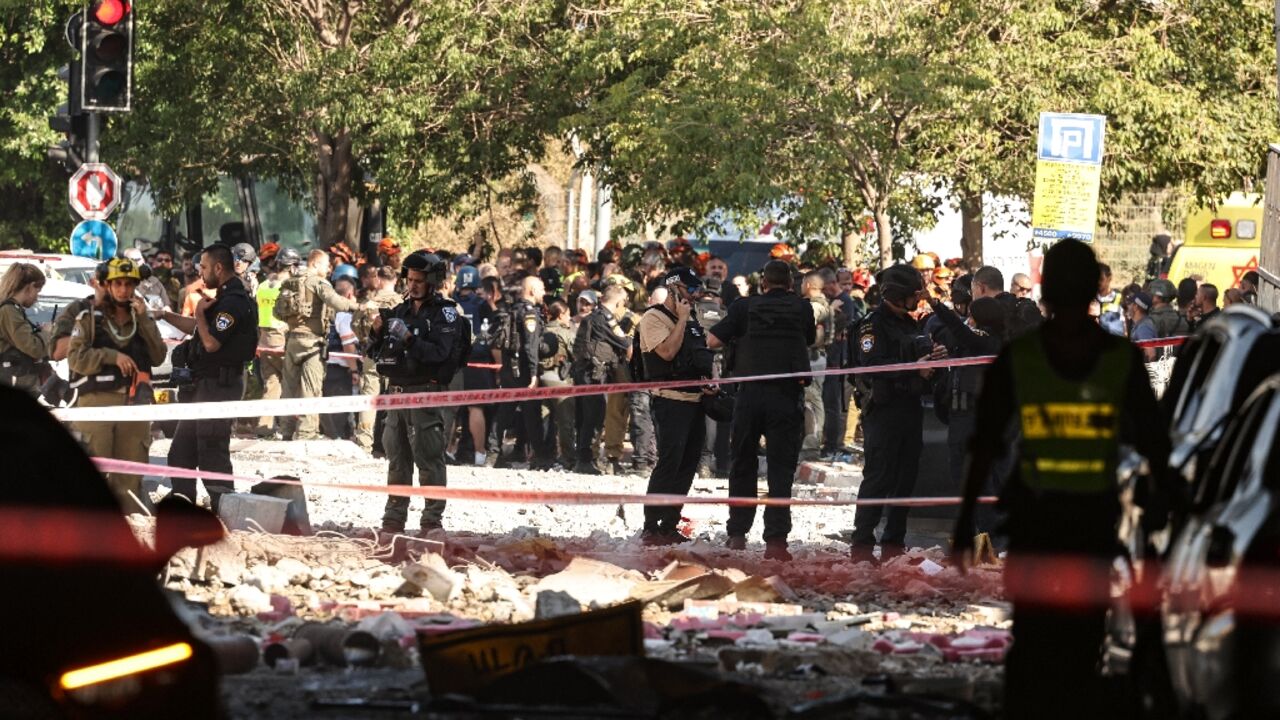 Israeli forces cordon off an area  in the coastal city of Haifa after Iranian missile fire